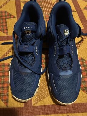 Deep Blue Athletic Sneakers with White Sole Accents Donovan Mitchell’s